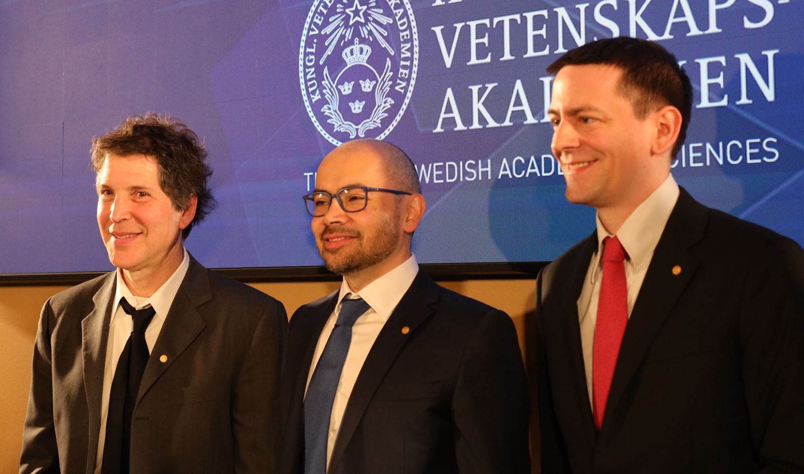 David Baker, Demis Hassabis and John Jumper seated together at a 2024 Nobel Prize press conference