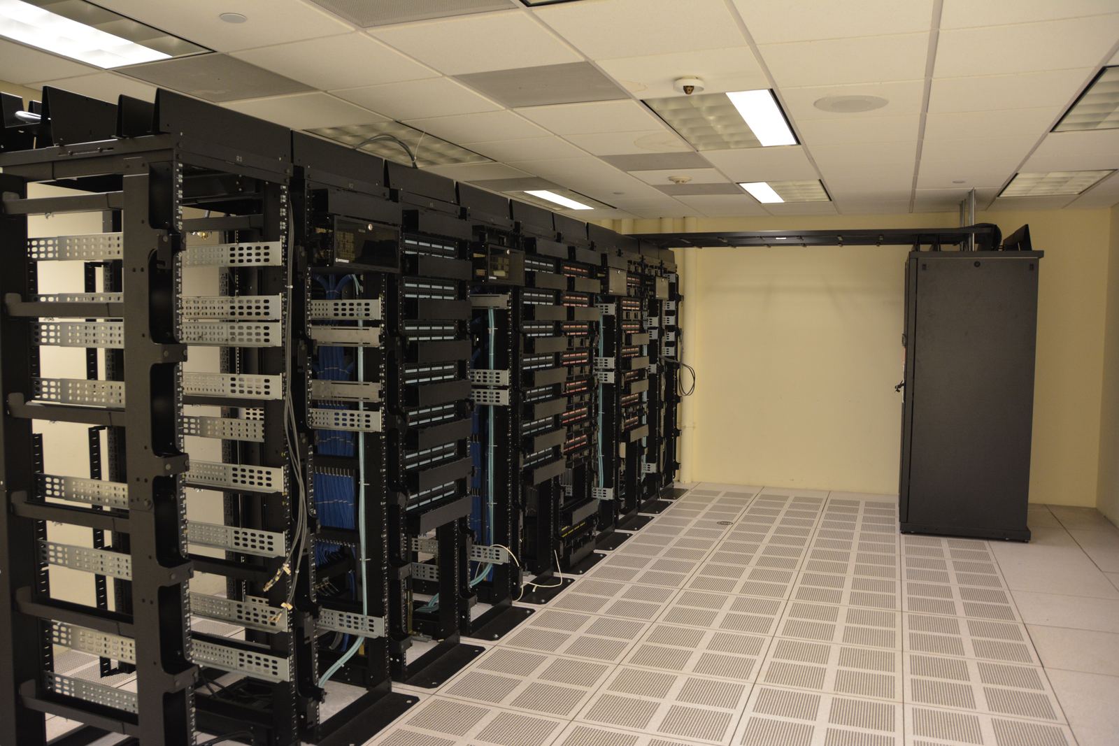 Rows of server racks with blinking lights inside a data center